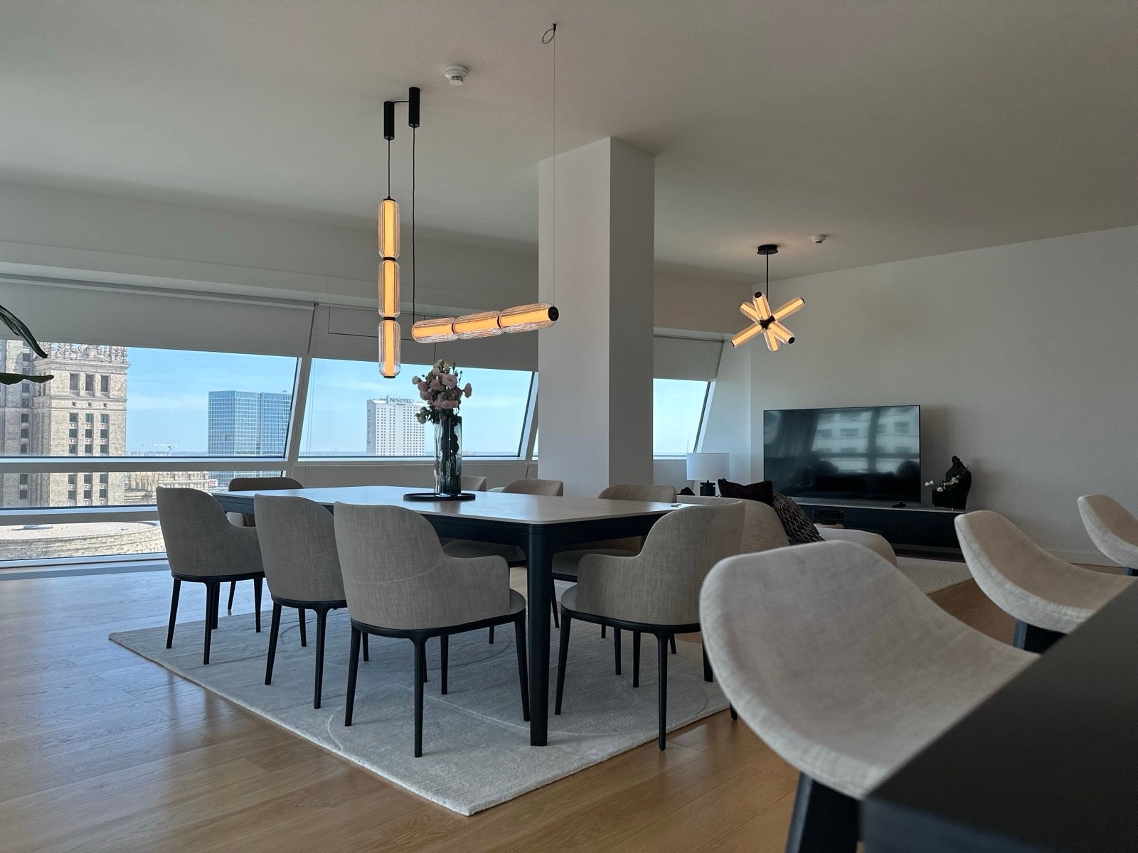 3-room apartment in Złota 44: dining room and living room with a view of the Palace of Culture